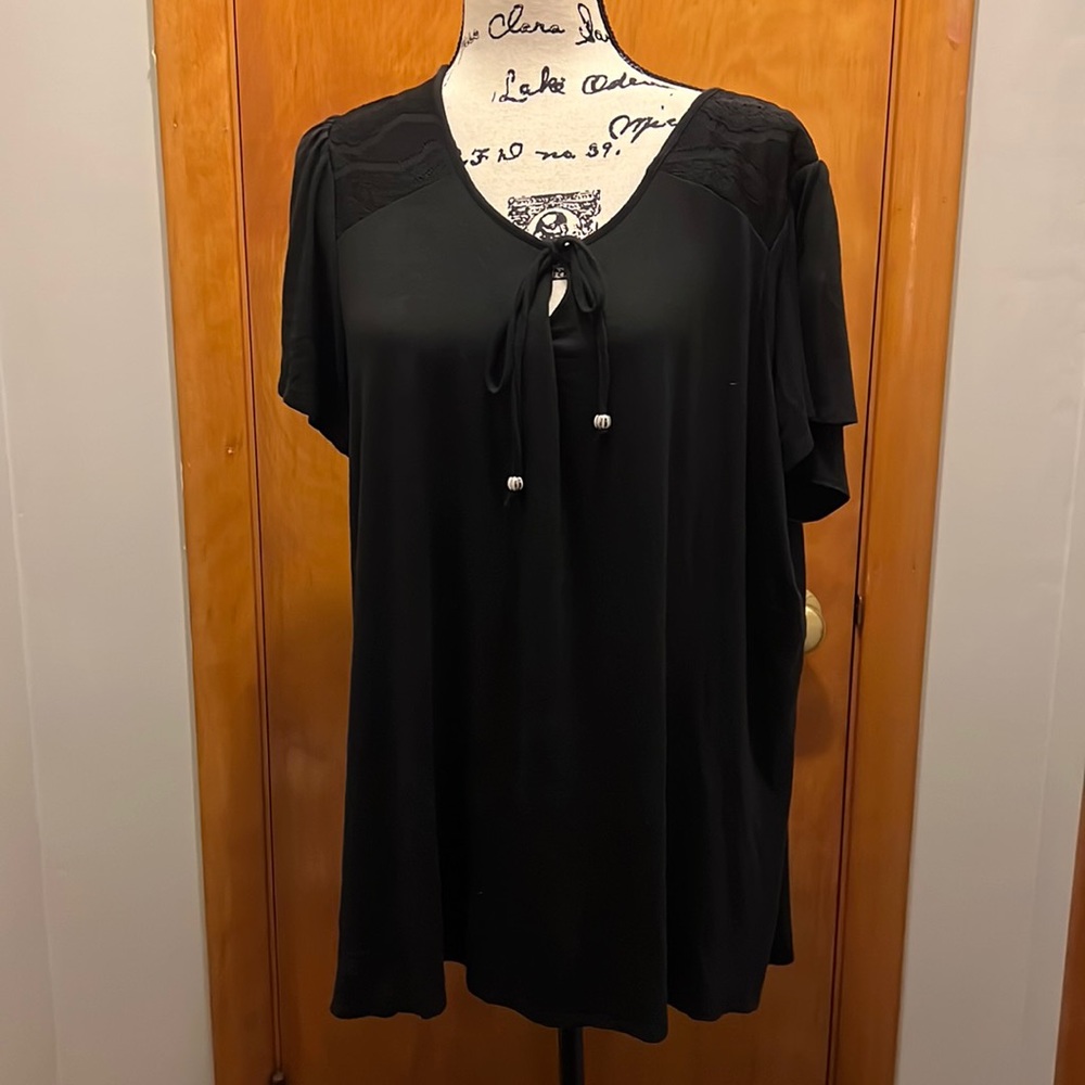 Avenue black short sleeve top, with lace like overlay. Draw string closure.